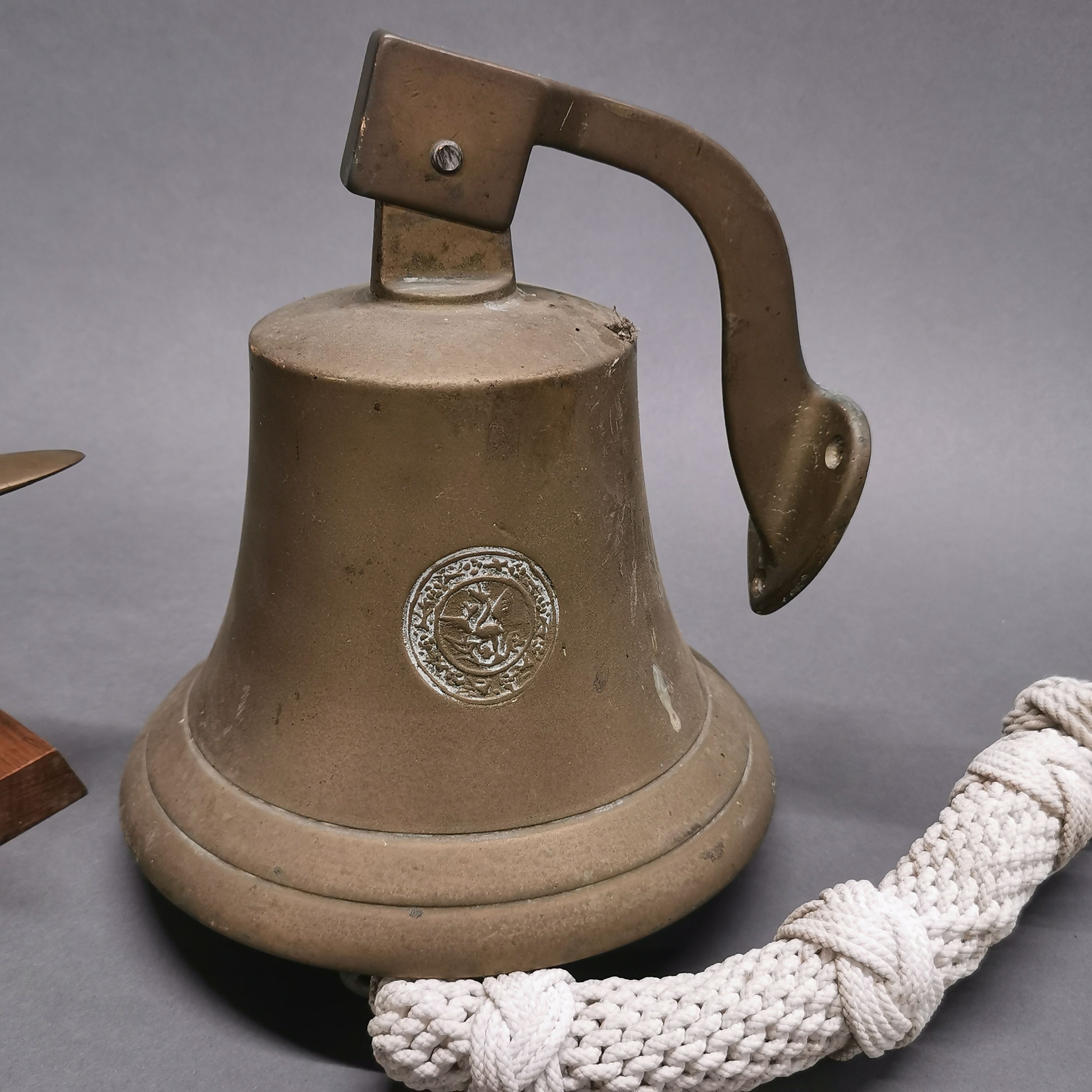 A wall mounted brass bell and a brass model of an aircraft, bell H. 22cm. - Image 3 of 4