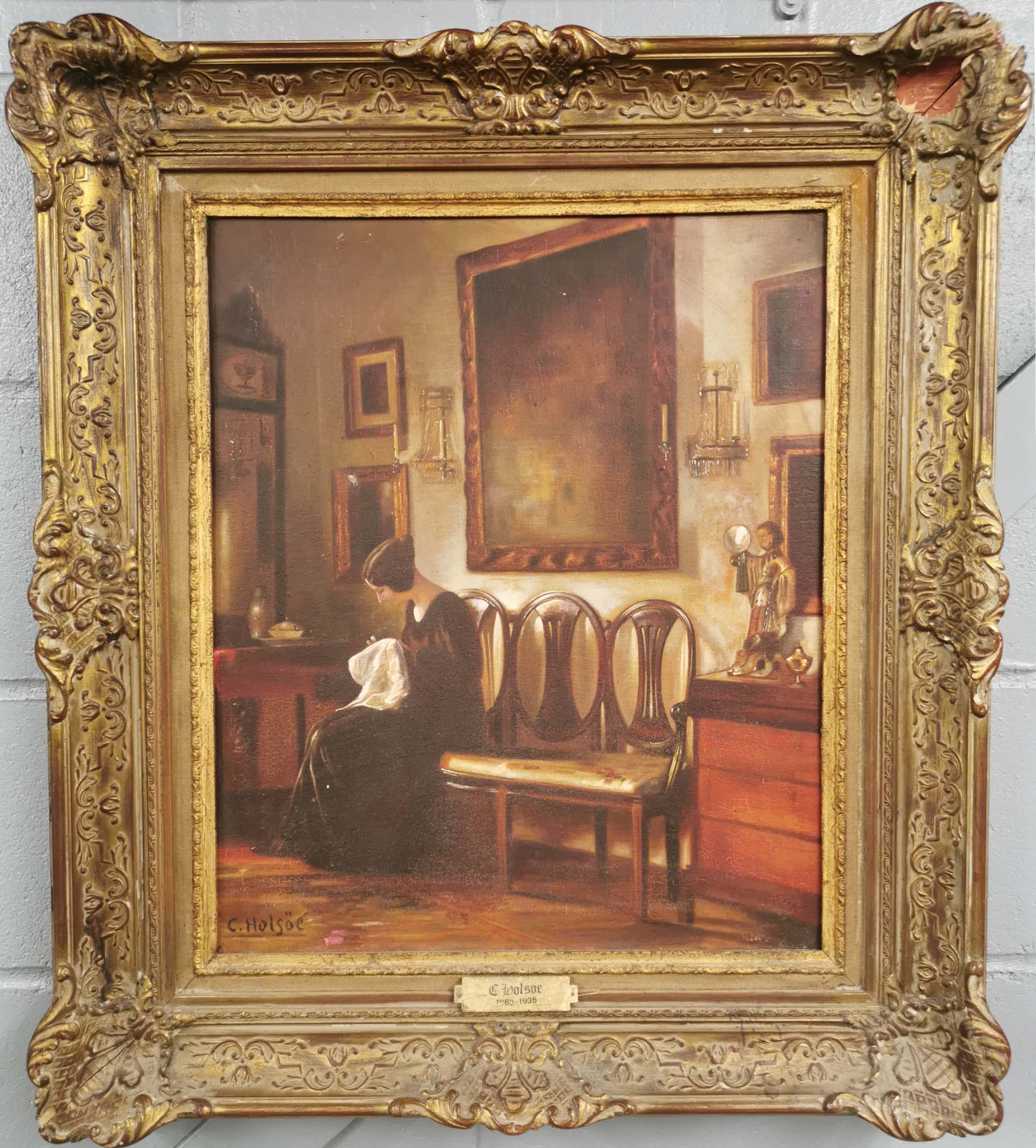 A gilt framed oil on canvas interior scene after C. Holsoe (1863-1935), frame size 68 x 77cm.