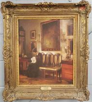 A gilt framed oil on canvas interior scene after C. Holsoe (1863-1935), frame size 68 x 77cm.