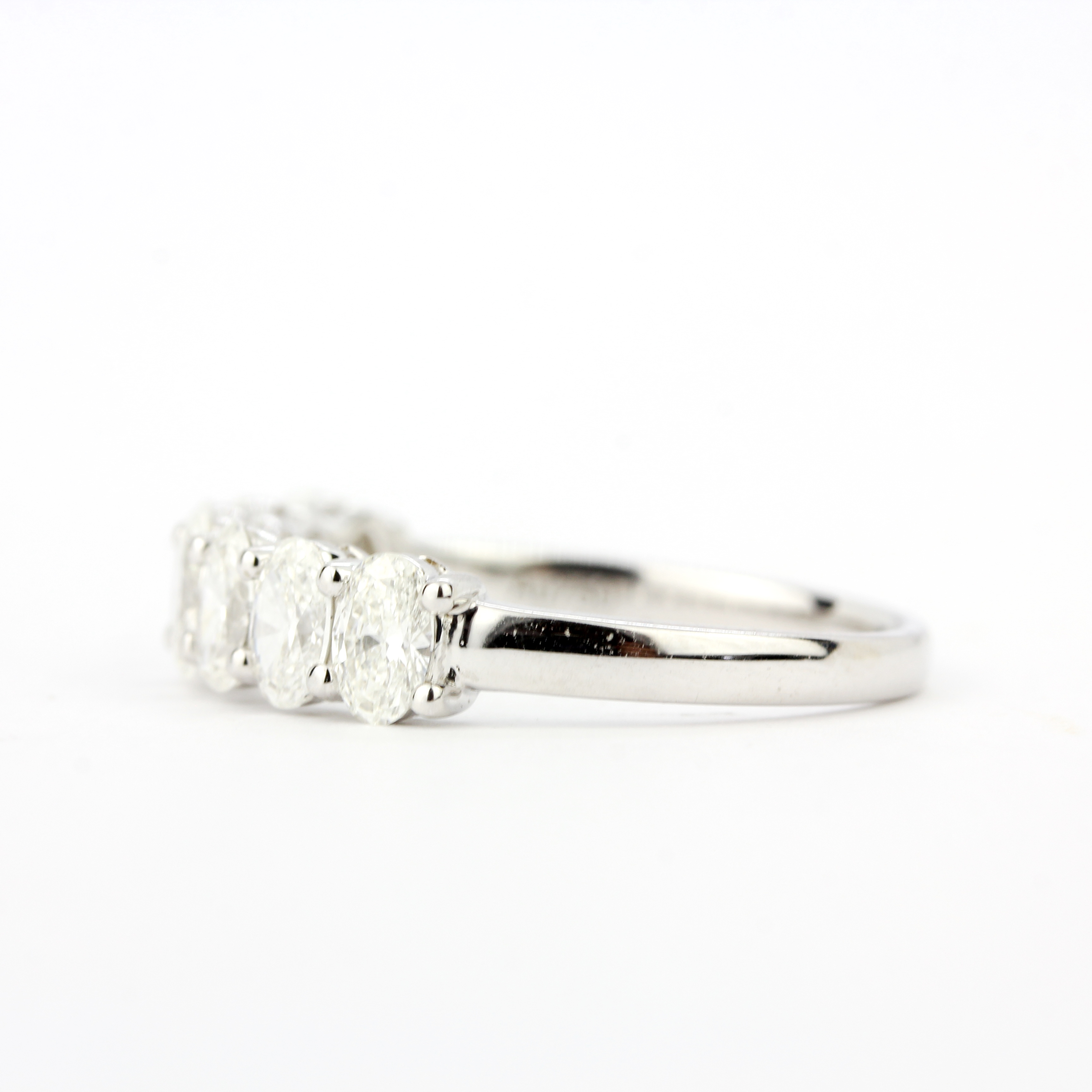 An 18ct white gold ring set with seven oval cut diamond, overall 1.37ct, ring size O.5 - Image 2 of 3