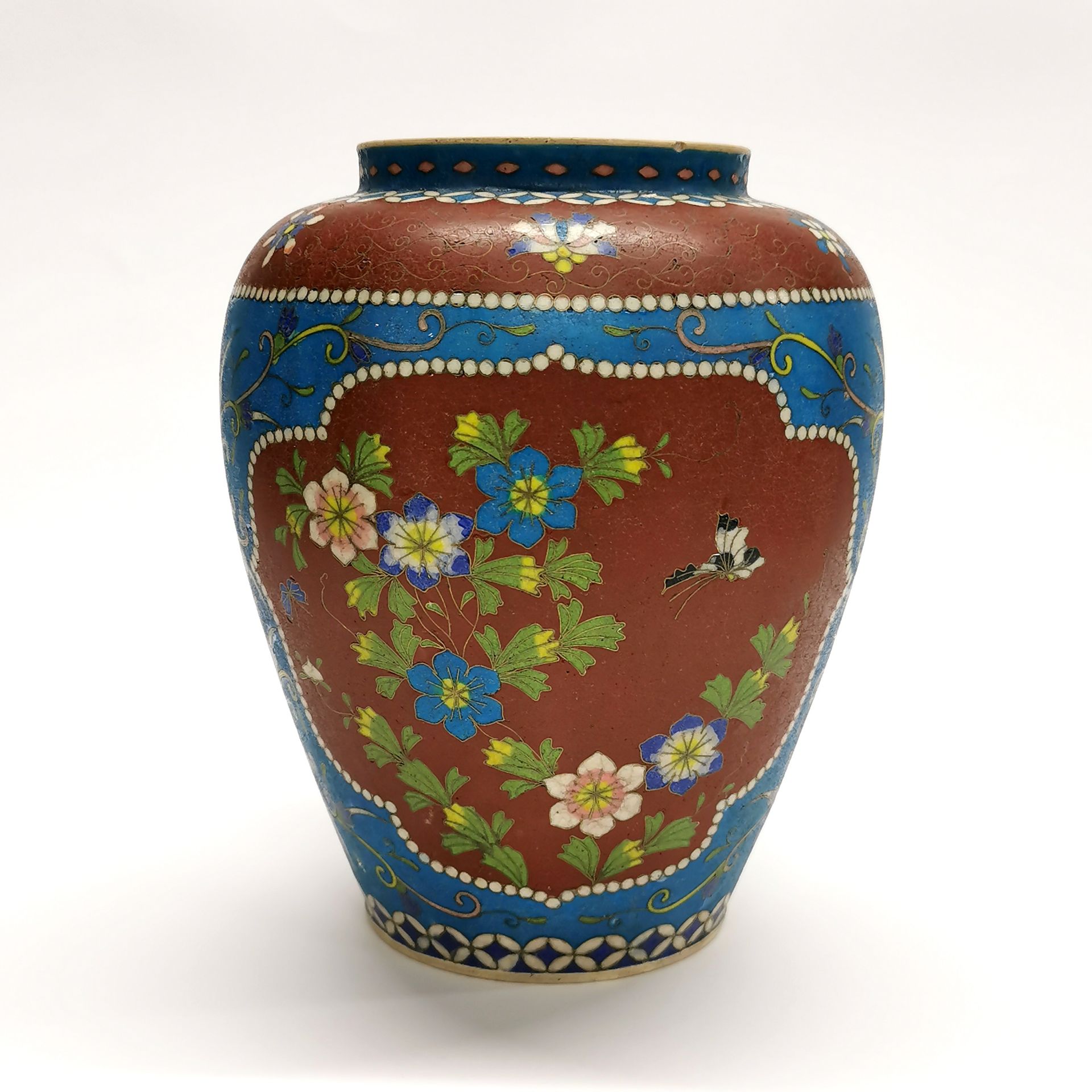 An unusual early 20th century Chinese cloisonne on ceramic vase, H. 22cm.
