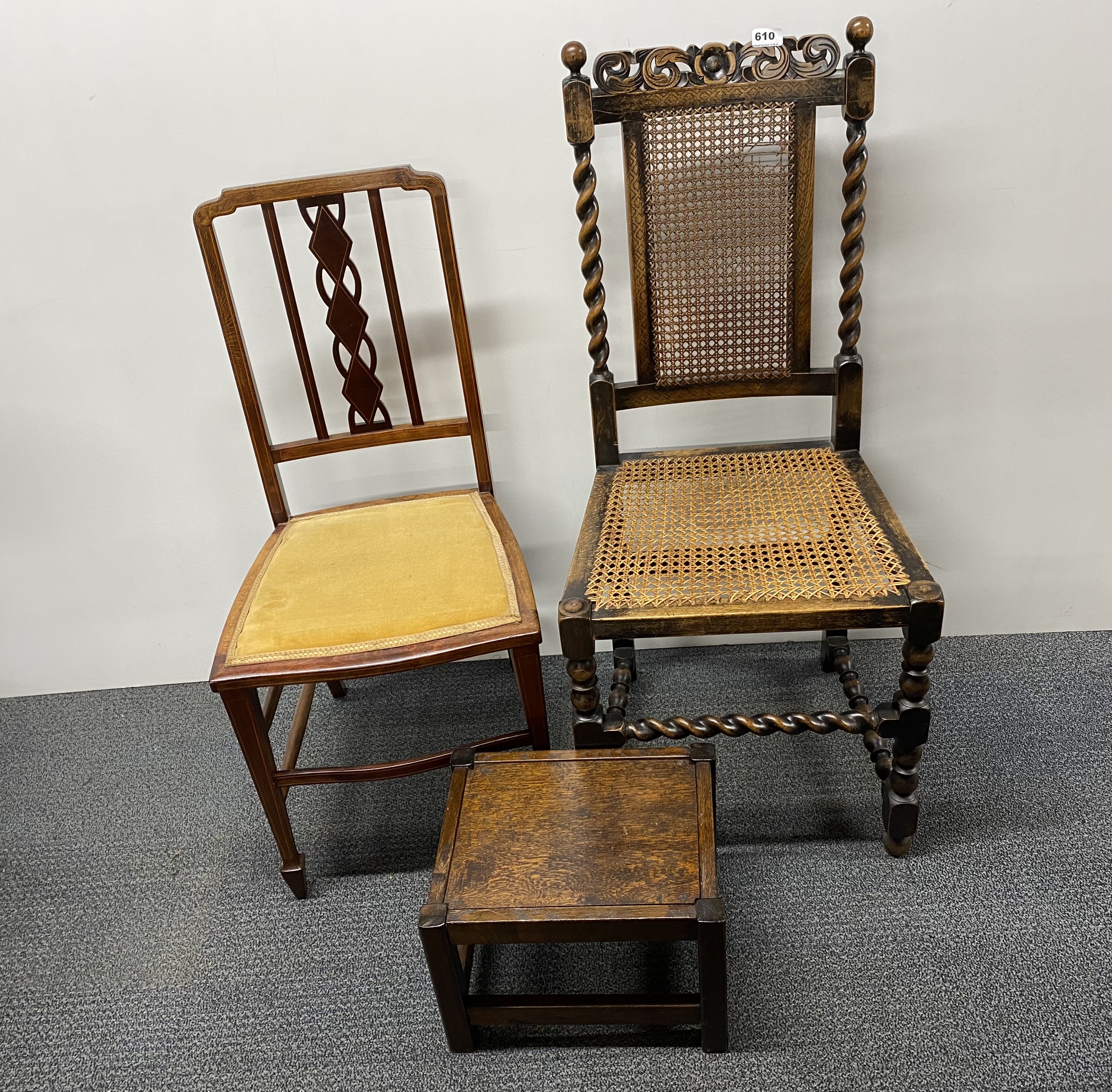A carved oak and cane hall chair together with an Edwardian chair and stool.