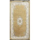 A Chinese design woolen rug, 215 x 125cm.