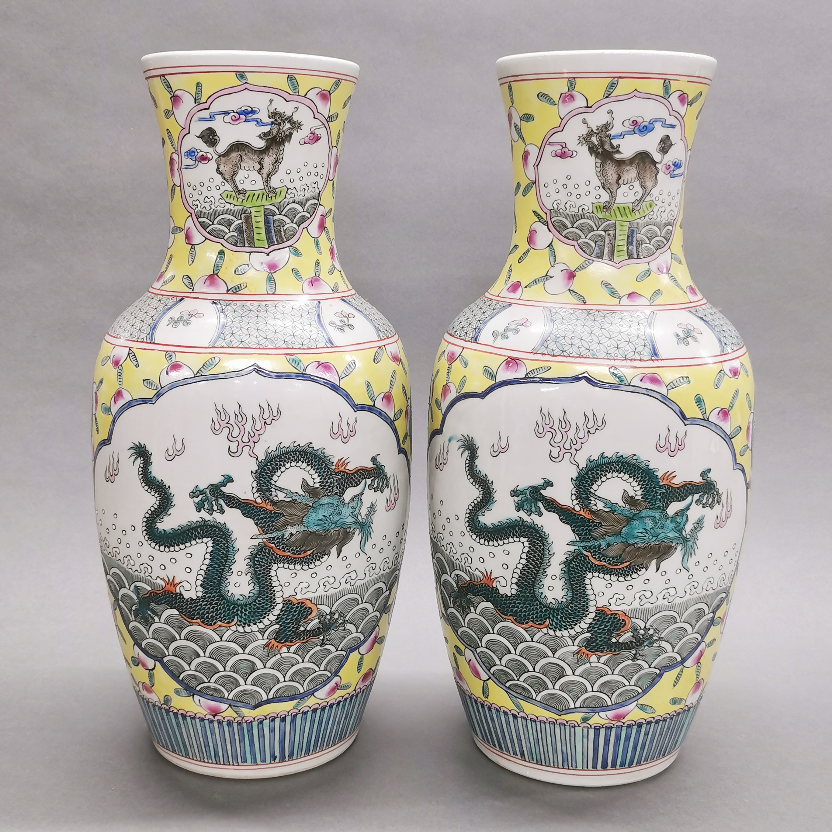 A pair of large Chinese hand enamelled porcelain vases, H. 44cm.