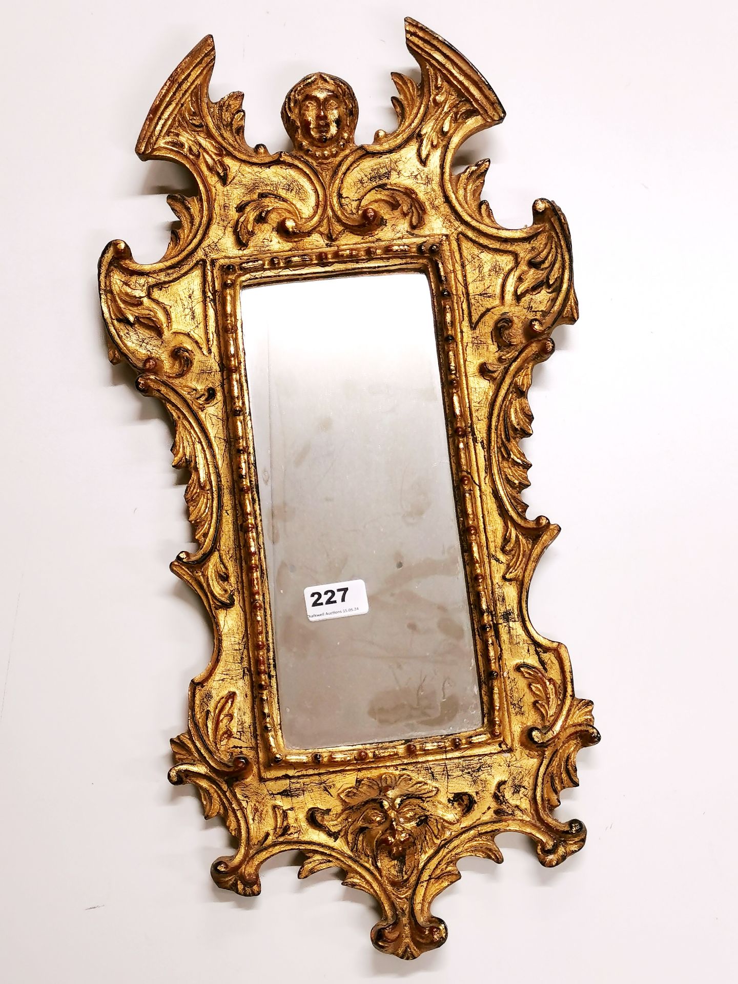 An Italian style gilt framed mirror, H. 60cm.