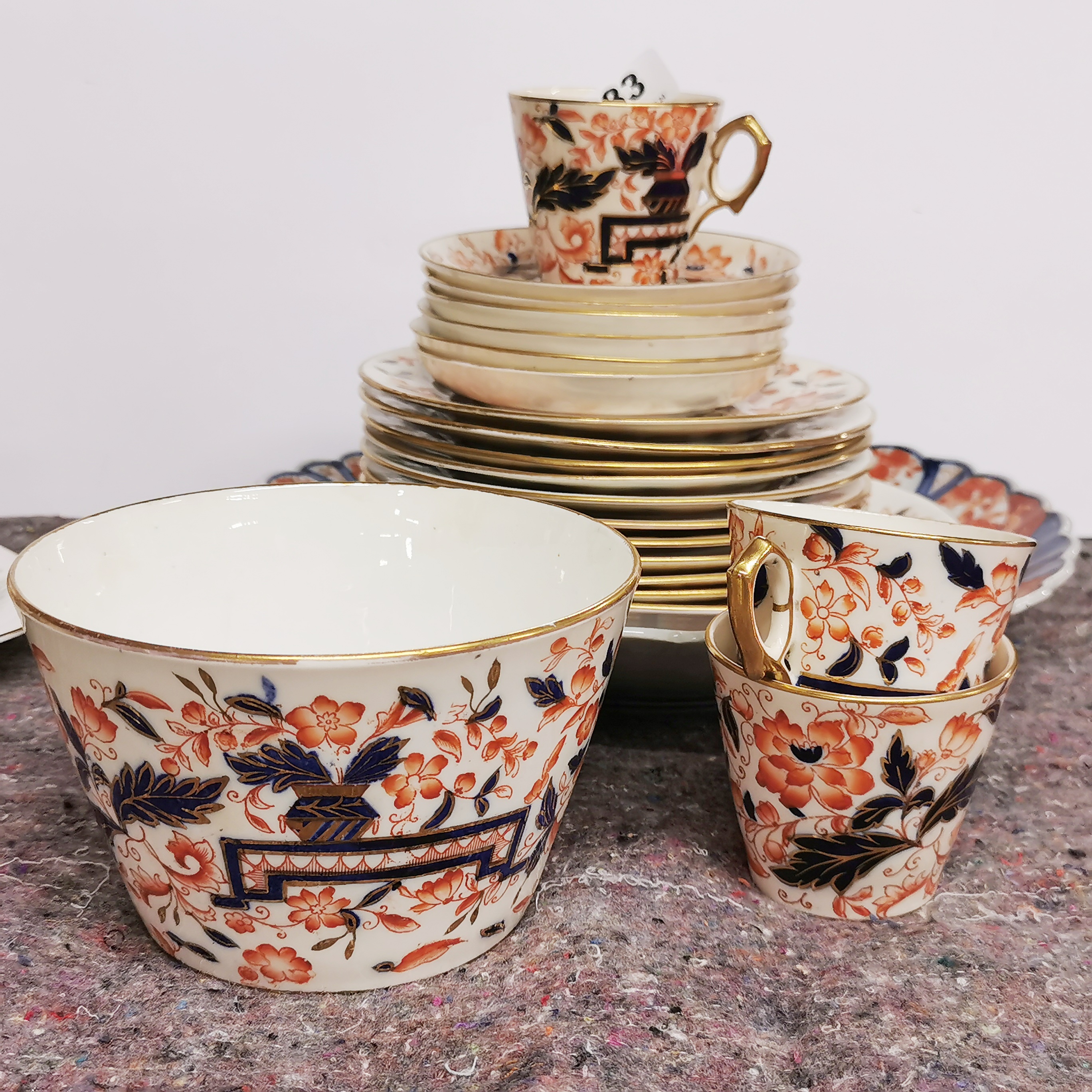 A 19thC Derby style part tea set with an Imari plate. - Image 2 of 3