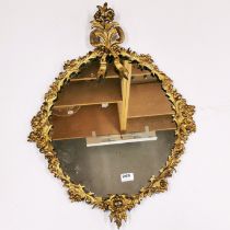 A 19thC French gilt brass wall mirror, H. 79cm.