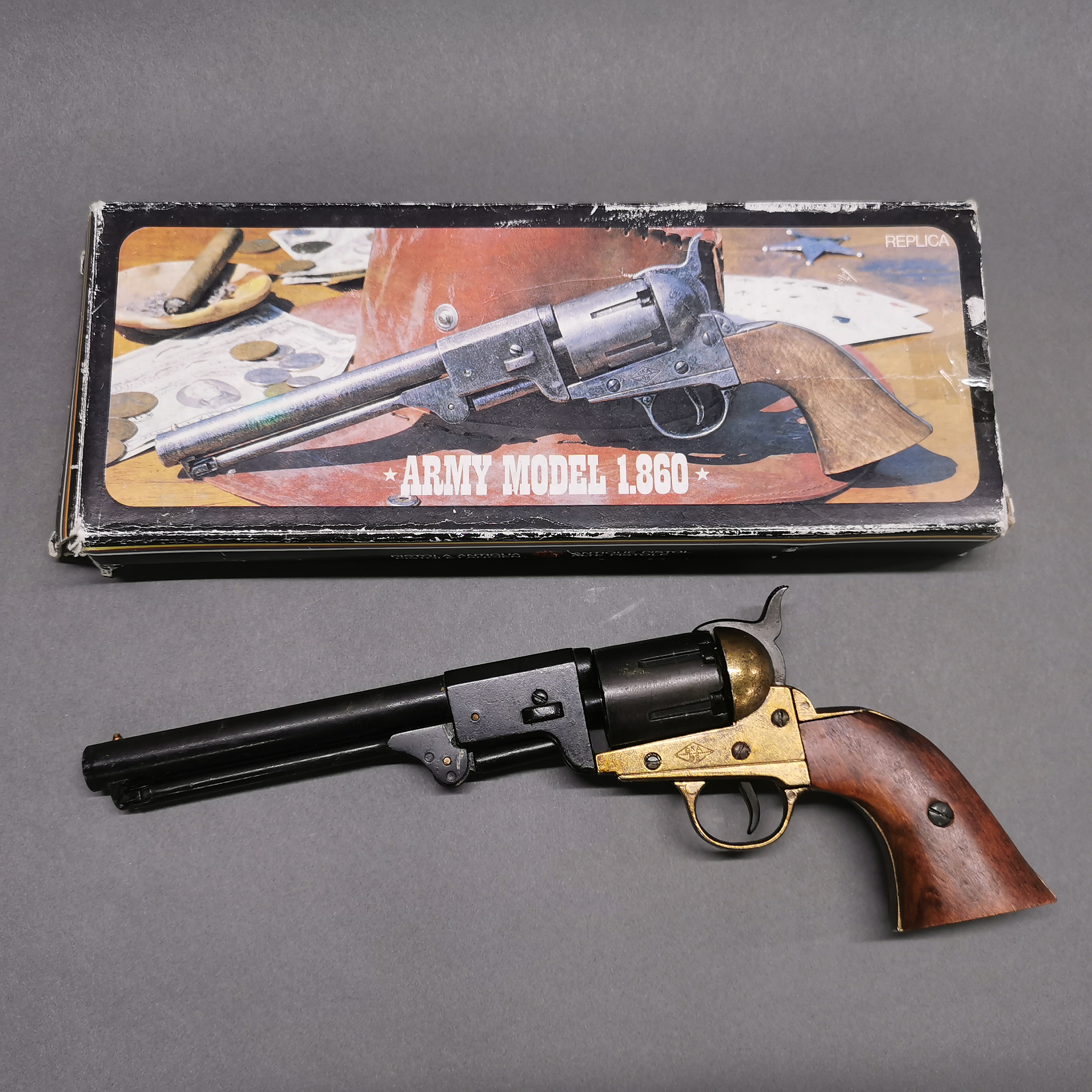 A vintage working action inert copy of a colt army 1860 revolver, full weight and size in original