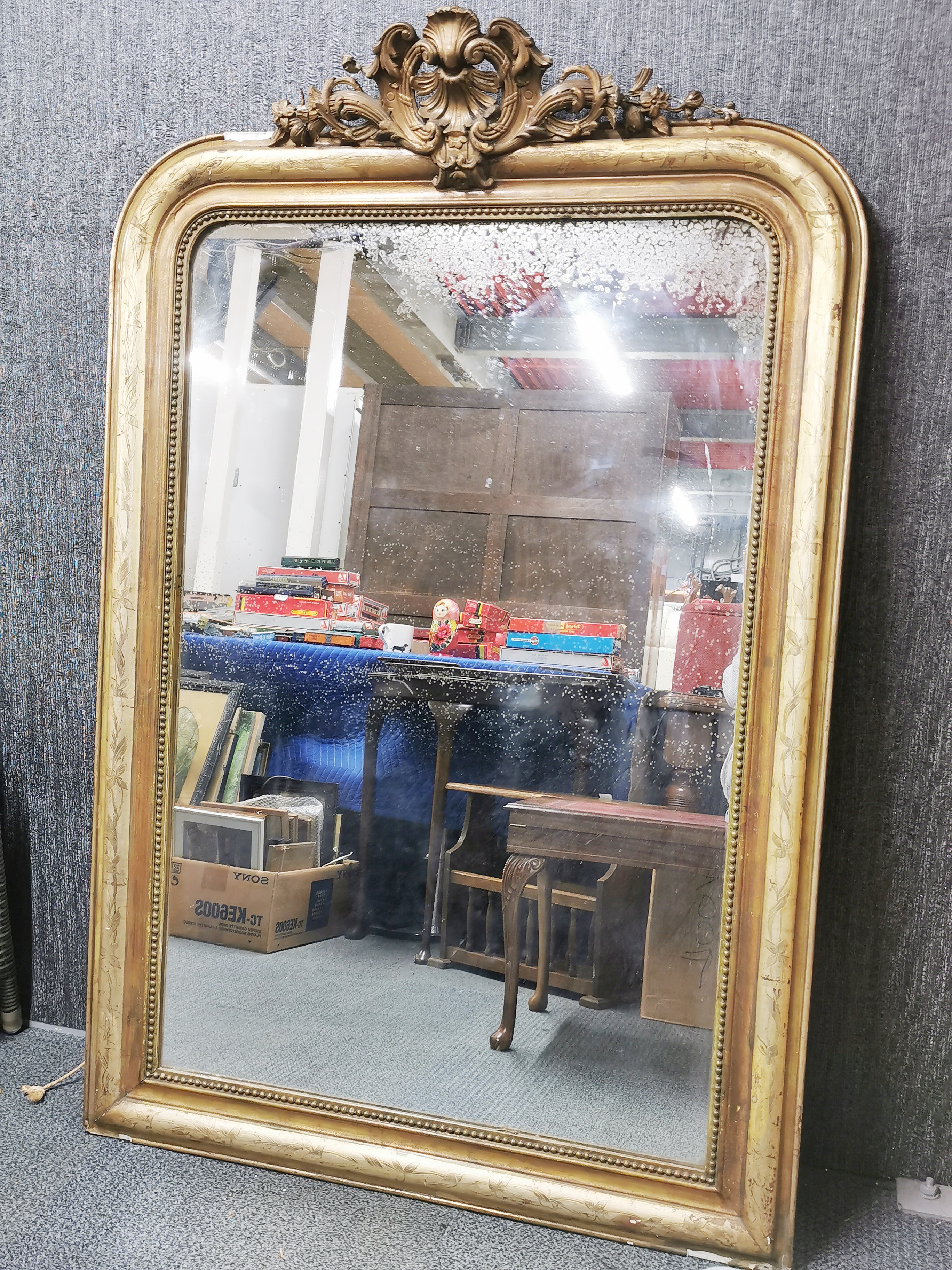 A large 19thC gilt framed mirror, W. 95, H. 145cm.