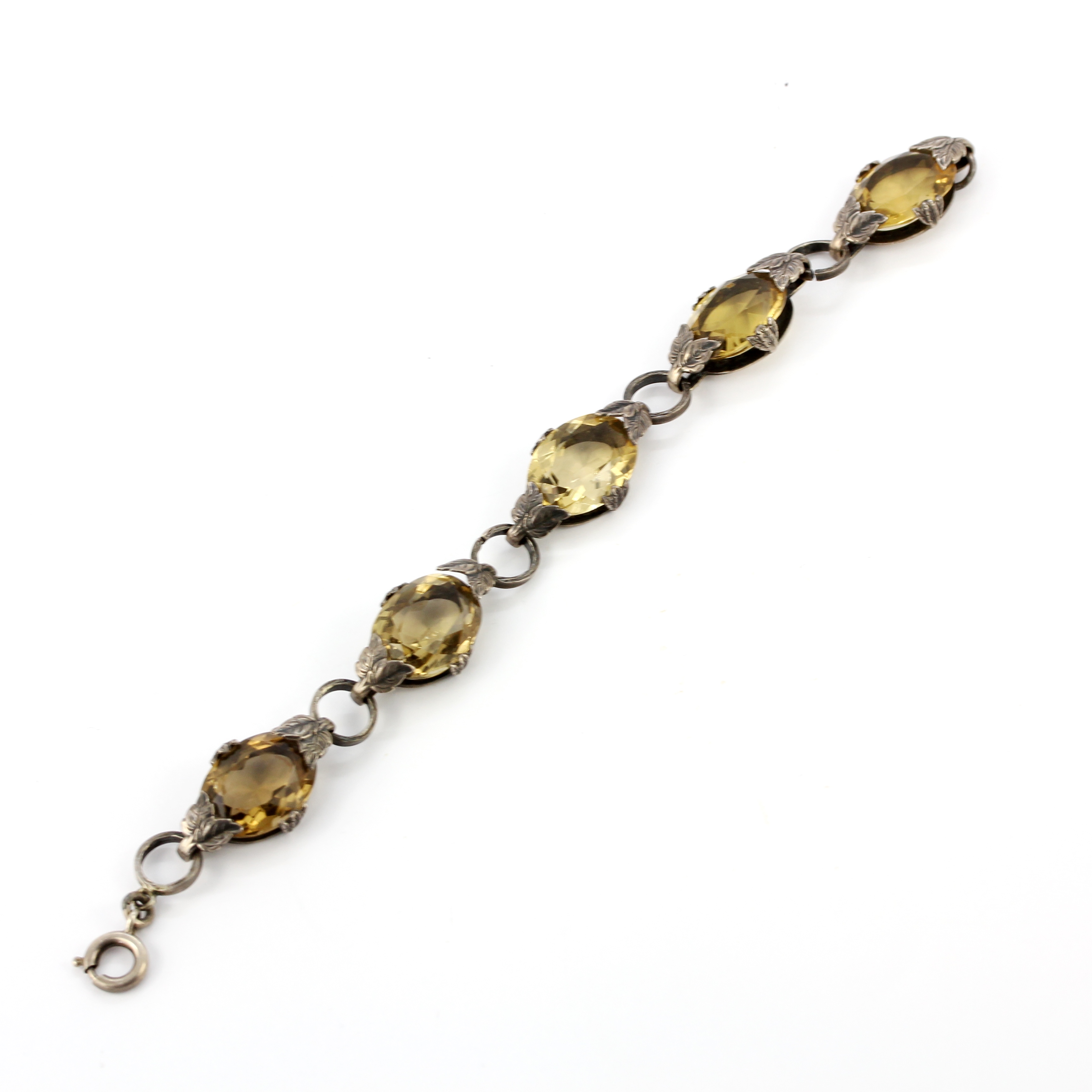 A silver bracelet set with oval cut citrines, L. 19cm. - Image 2 of 2