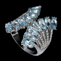 A 925 silver ring set with marquise cut blue topaz and white stones, ring size N.