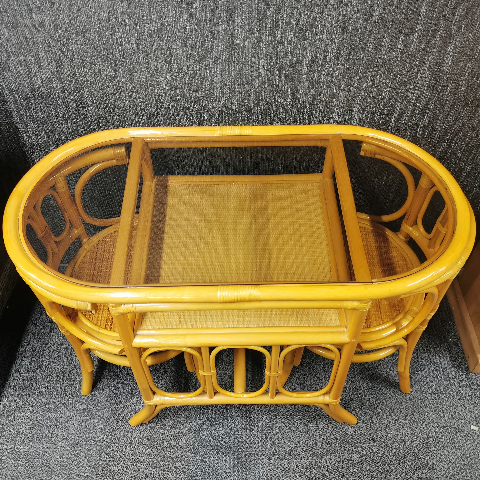 A vintage cane and glass conservatory/ kitchen set of table and two chairs, W. 110cm. - Image 2 of 3