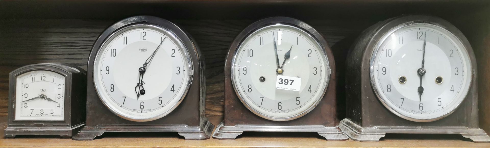 Four bakelite mantel clocks, largest H. 19cm.