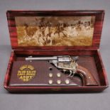 A boxed working action two tone inert retrospective copy of a colt single action army revolver, full