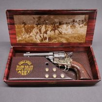 A boxed working action two tone inert retrospective copy of a colt single action army revolver, full