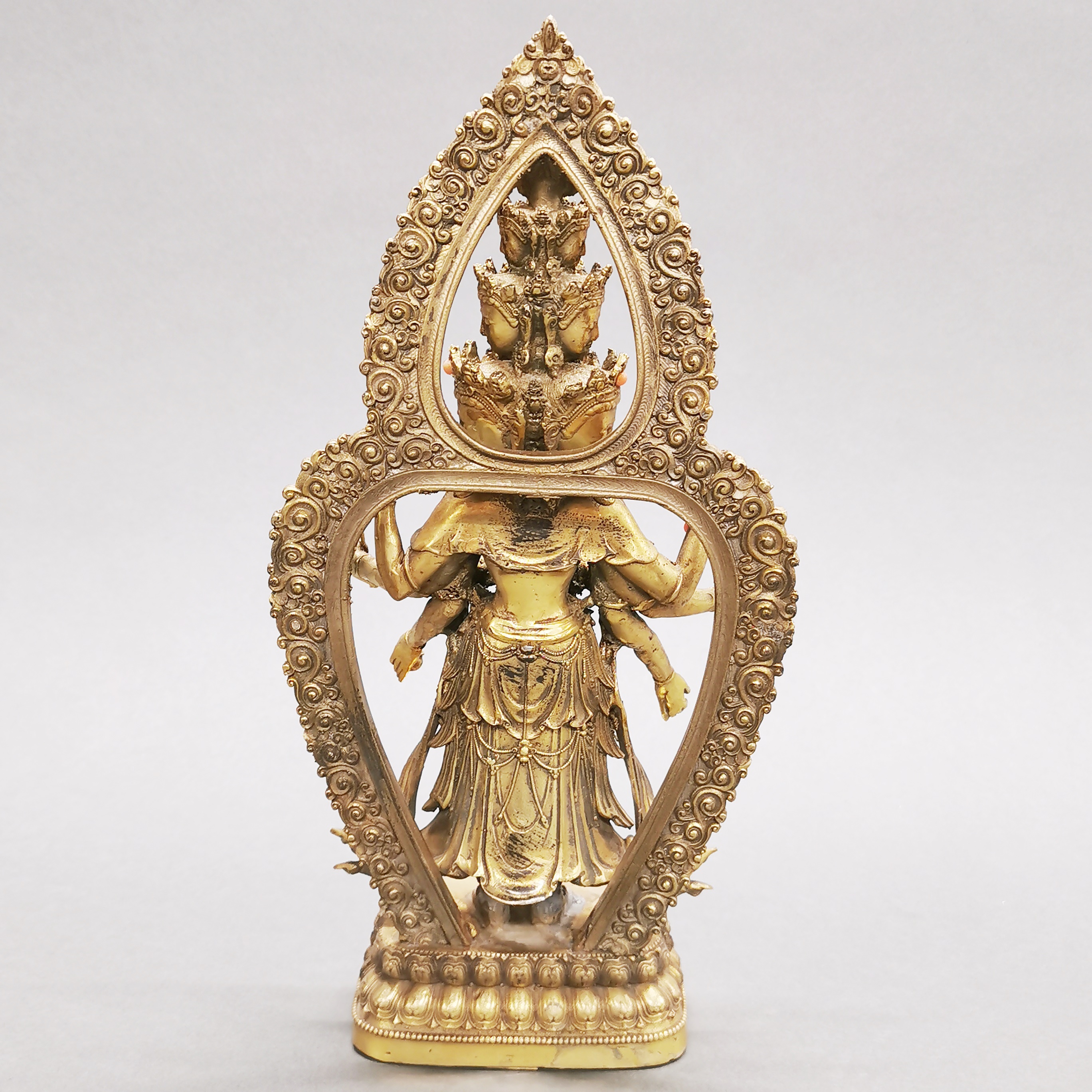 A Tibetan jewelled gilt bronze figure of a multi-armed deity, H. 28cm. - Image 2 of 3
