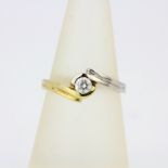 A 14ct yellow and white gold diamond set solitaire ring, approx. 0.33ct, ring size O.