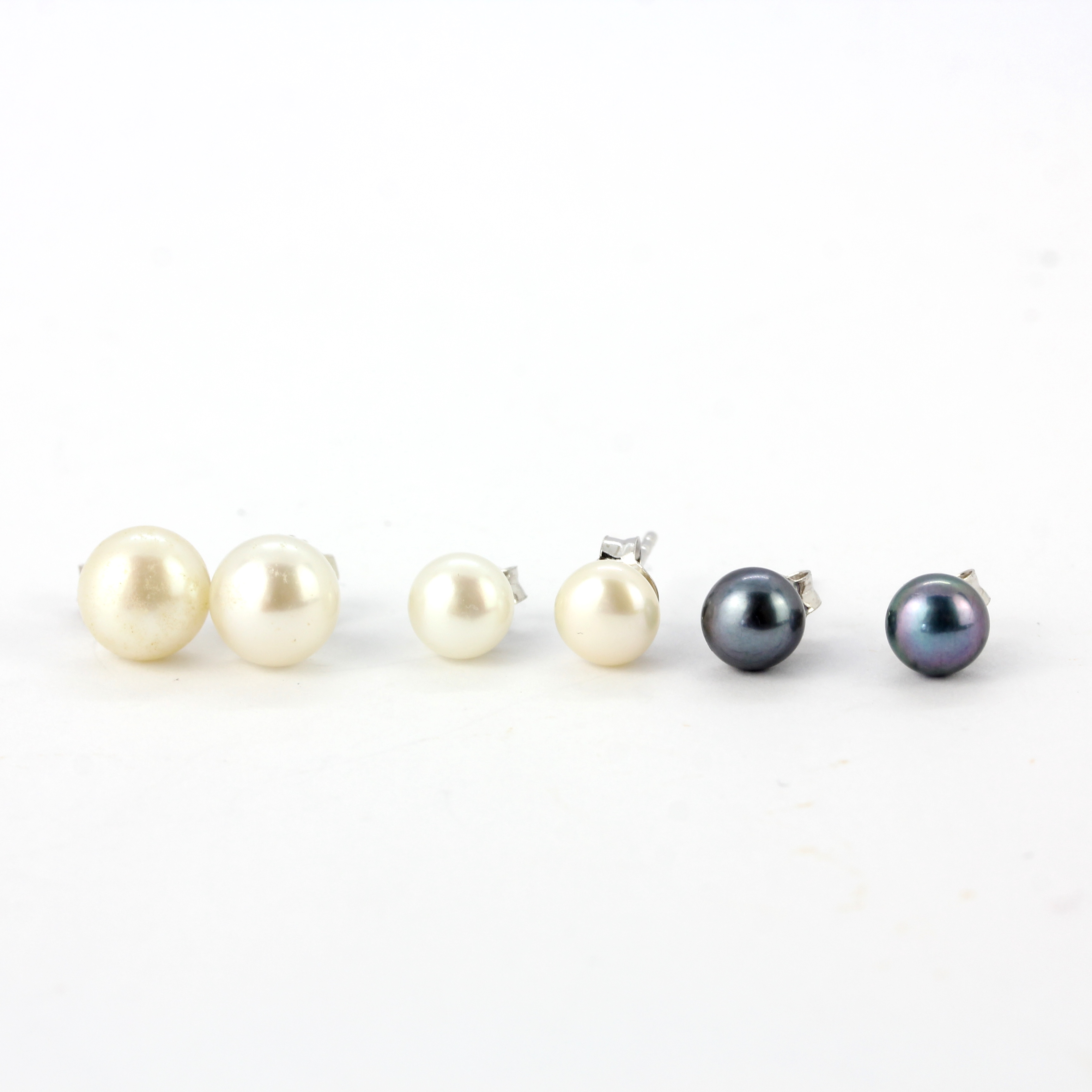 Three pairs of 925 silver pearl set stud earrings