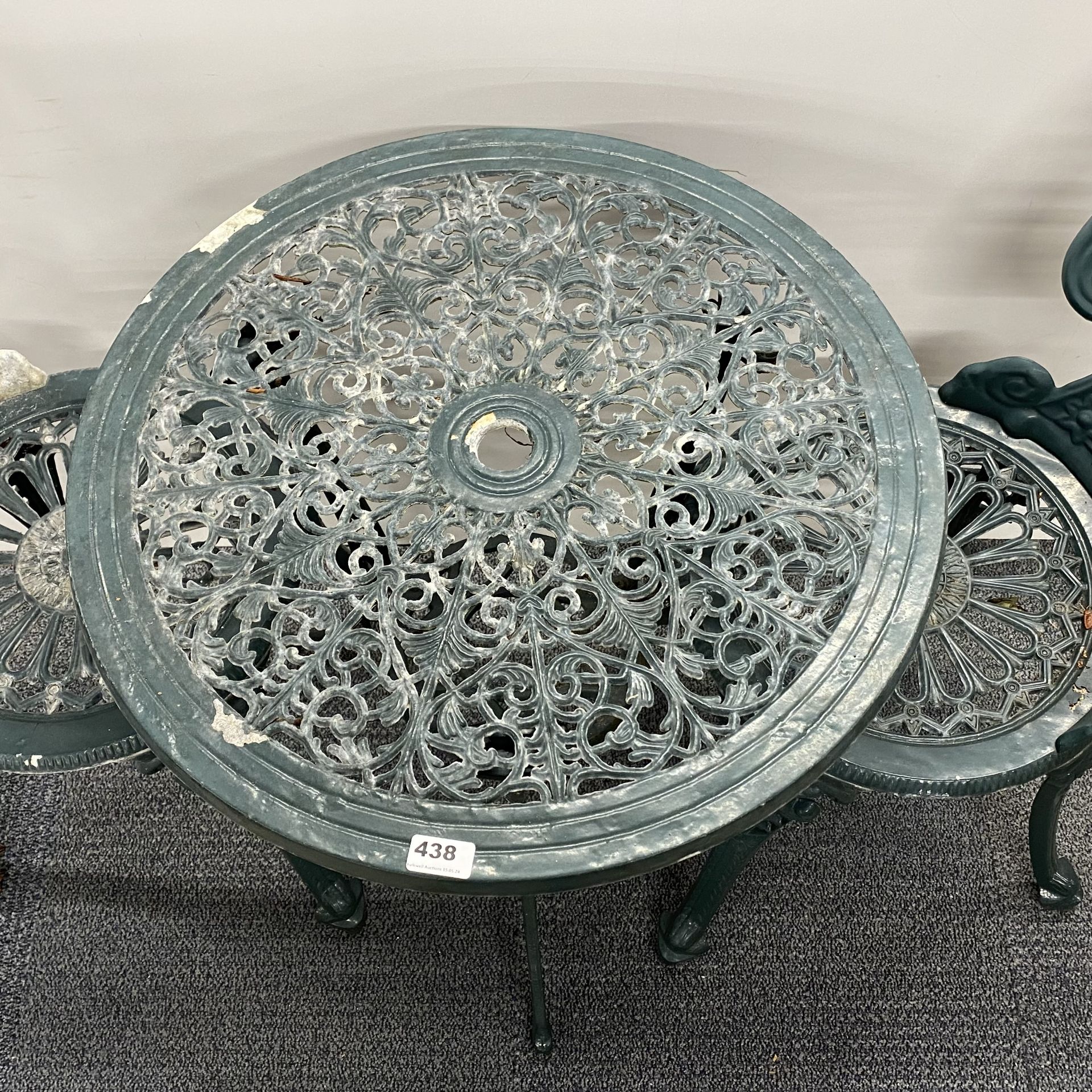 A cast iron garden table and two chairs, table 60 x 63cm. - Image 2 of 3