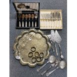 An engraved Indian brass tray, dia 38cm. Together with a group of silverplated items.