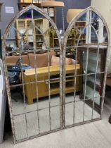 A pair of large metal framed garden mirrors, H. 159cm.