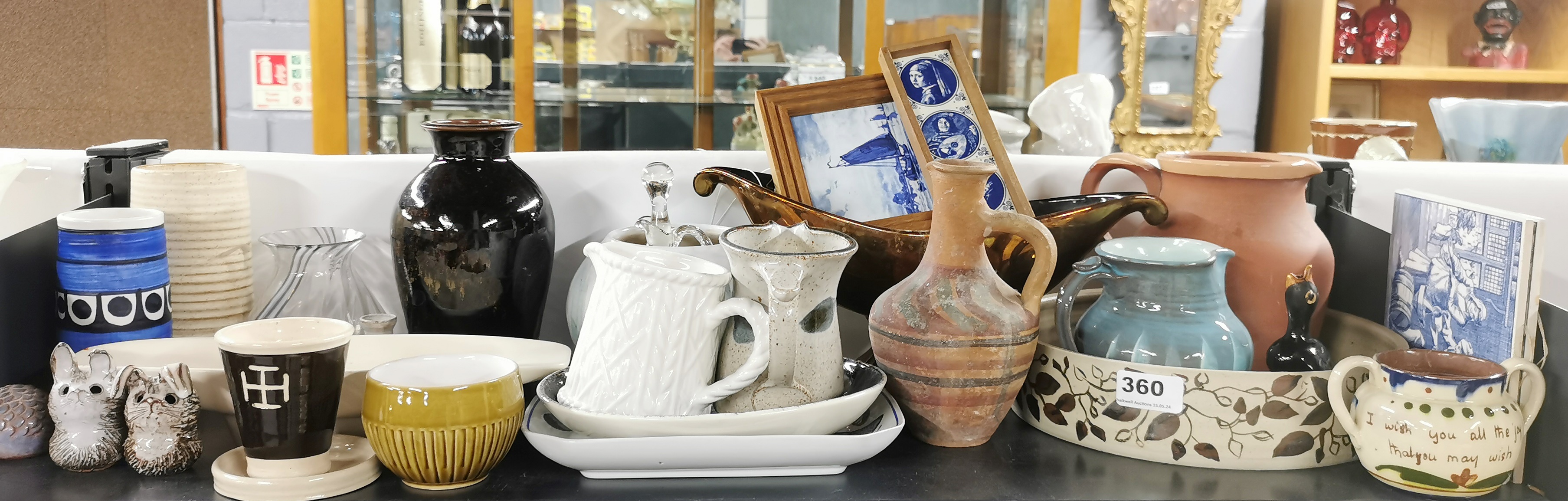 A quantity of studio pottery and other items.