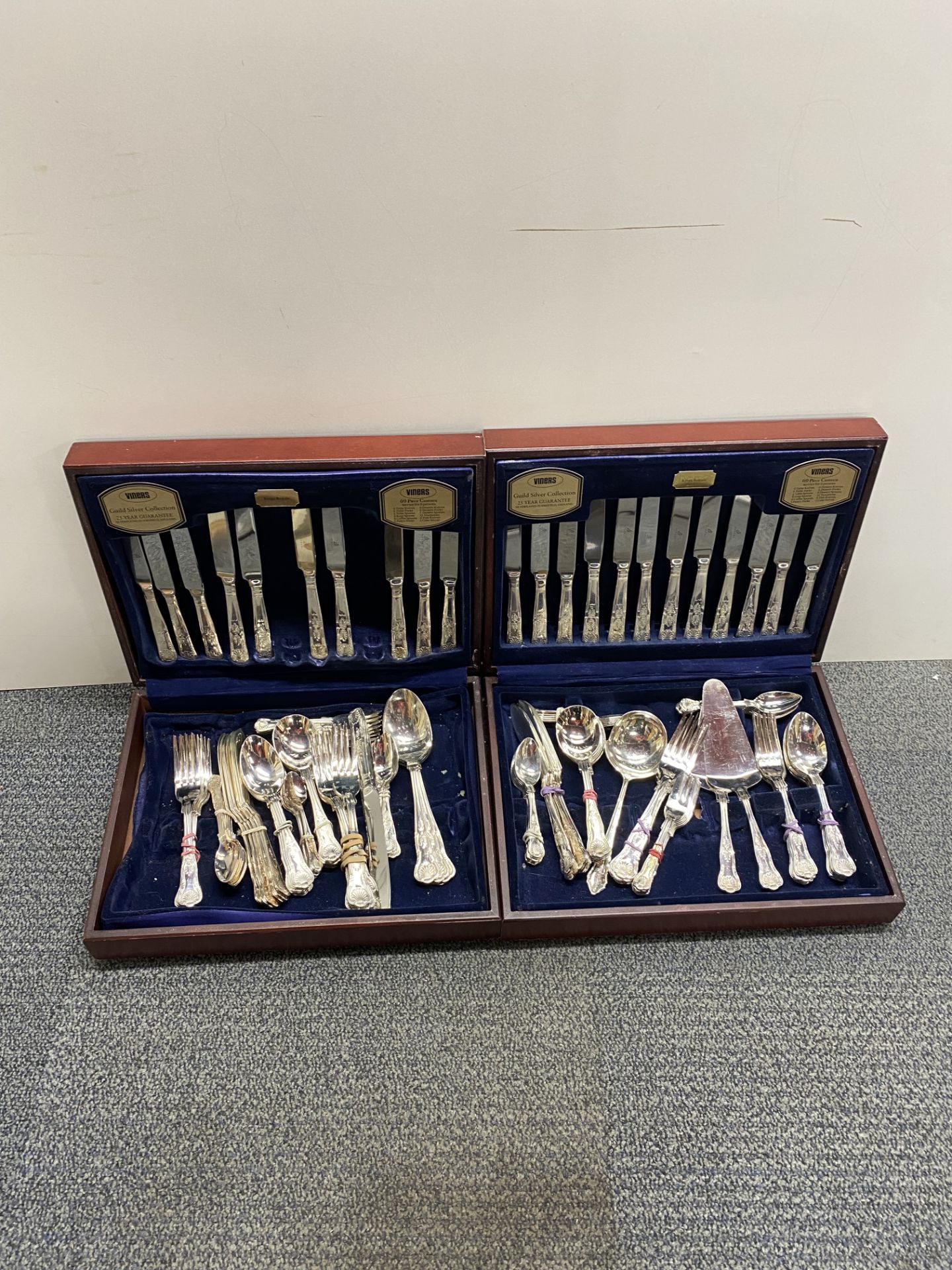 Two cased silverplated cutlery sets.