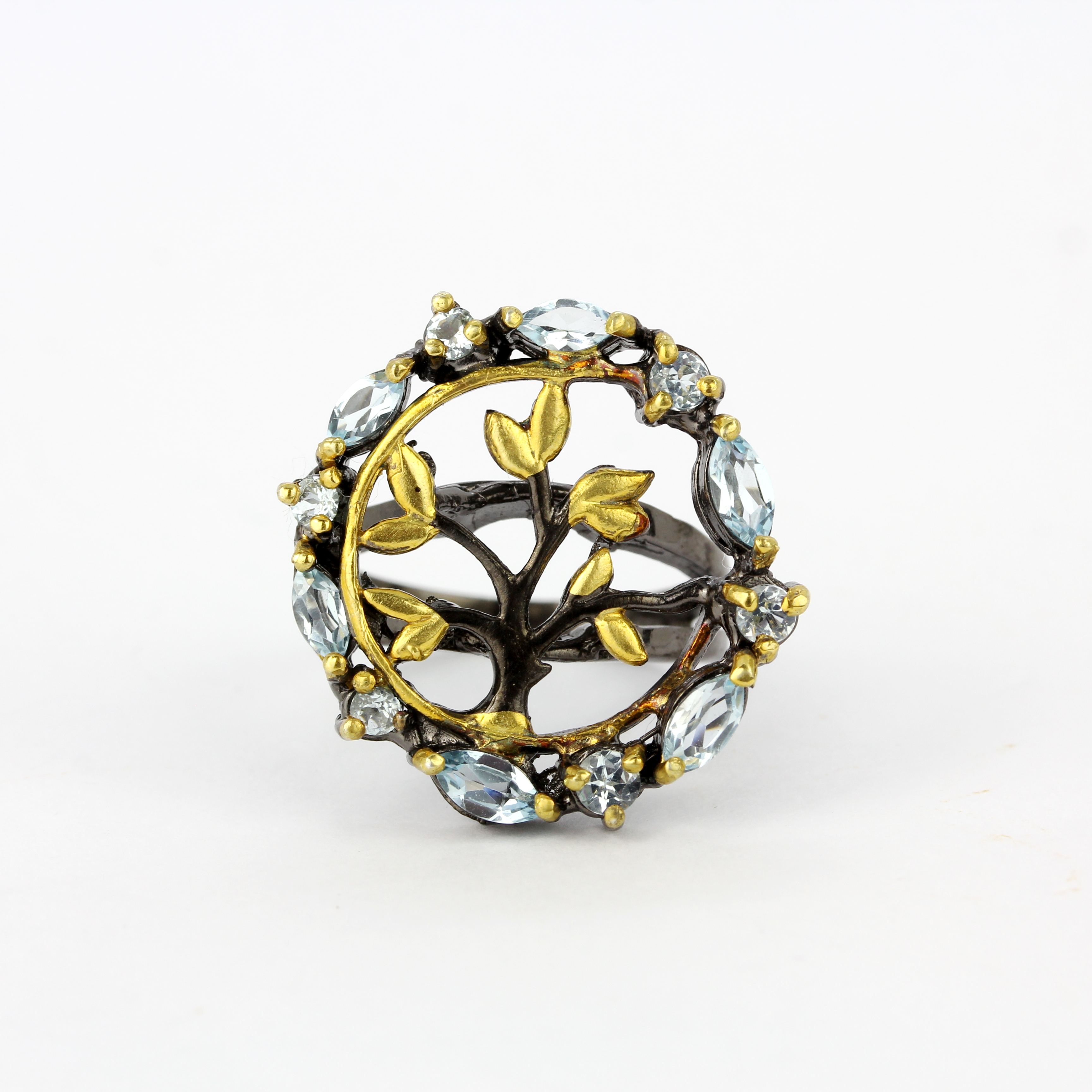A 925 silver gilt ring set with blue topaz, ring size R.