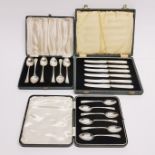 A set of hallmarked silver teaspoons, a set of EPNS teaspoons and a set of mother of pearl and