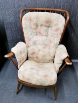 An Ercol style cottage armchair.