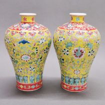 A pair of Chinese hand enamelled porcelain vases, H 20cm.