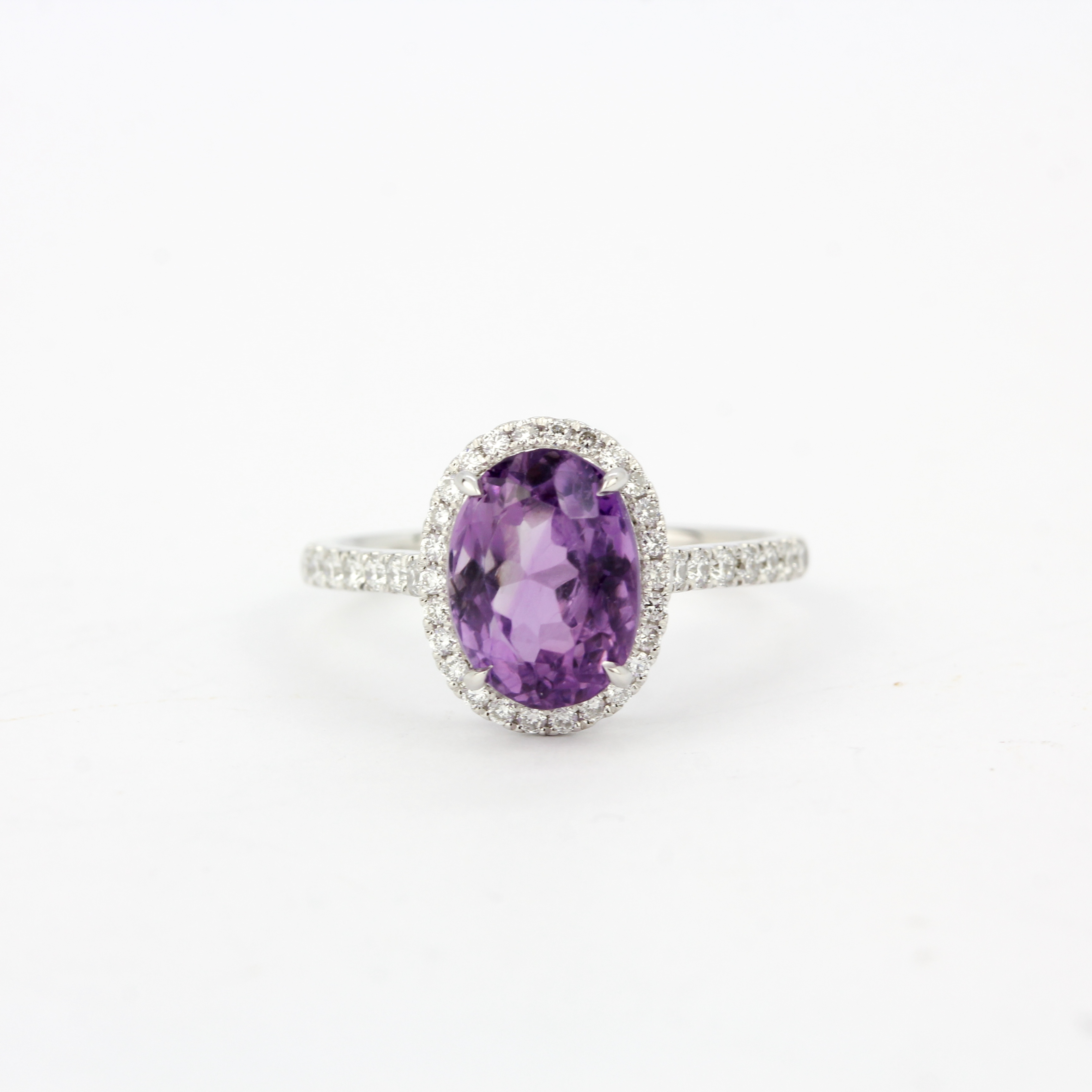 A 9ct white gold amethyst and diamond set ring, ring size N.5.