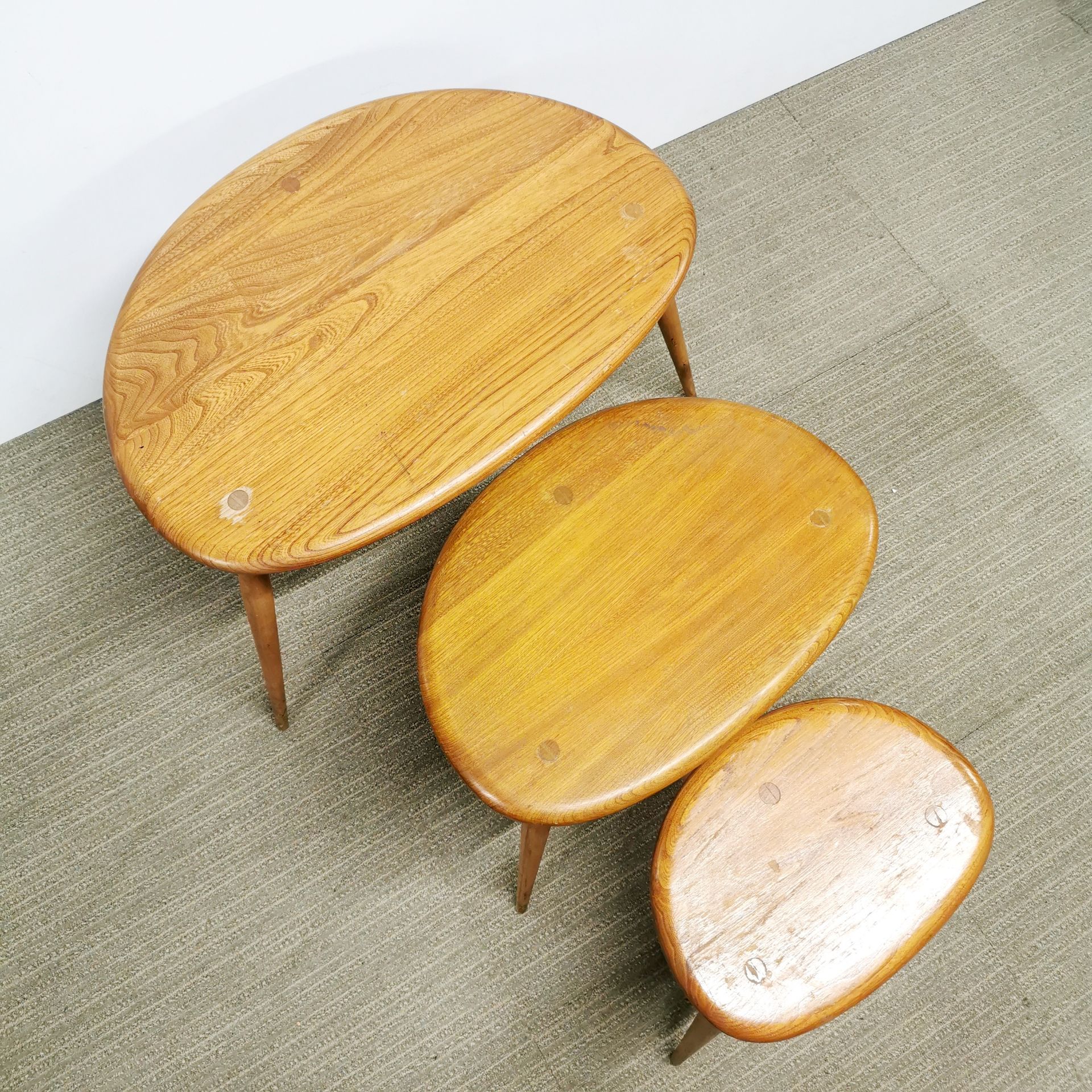 A nest of three Ercol pebble tables, largest W. 64cm. - Image 2 of 4