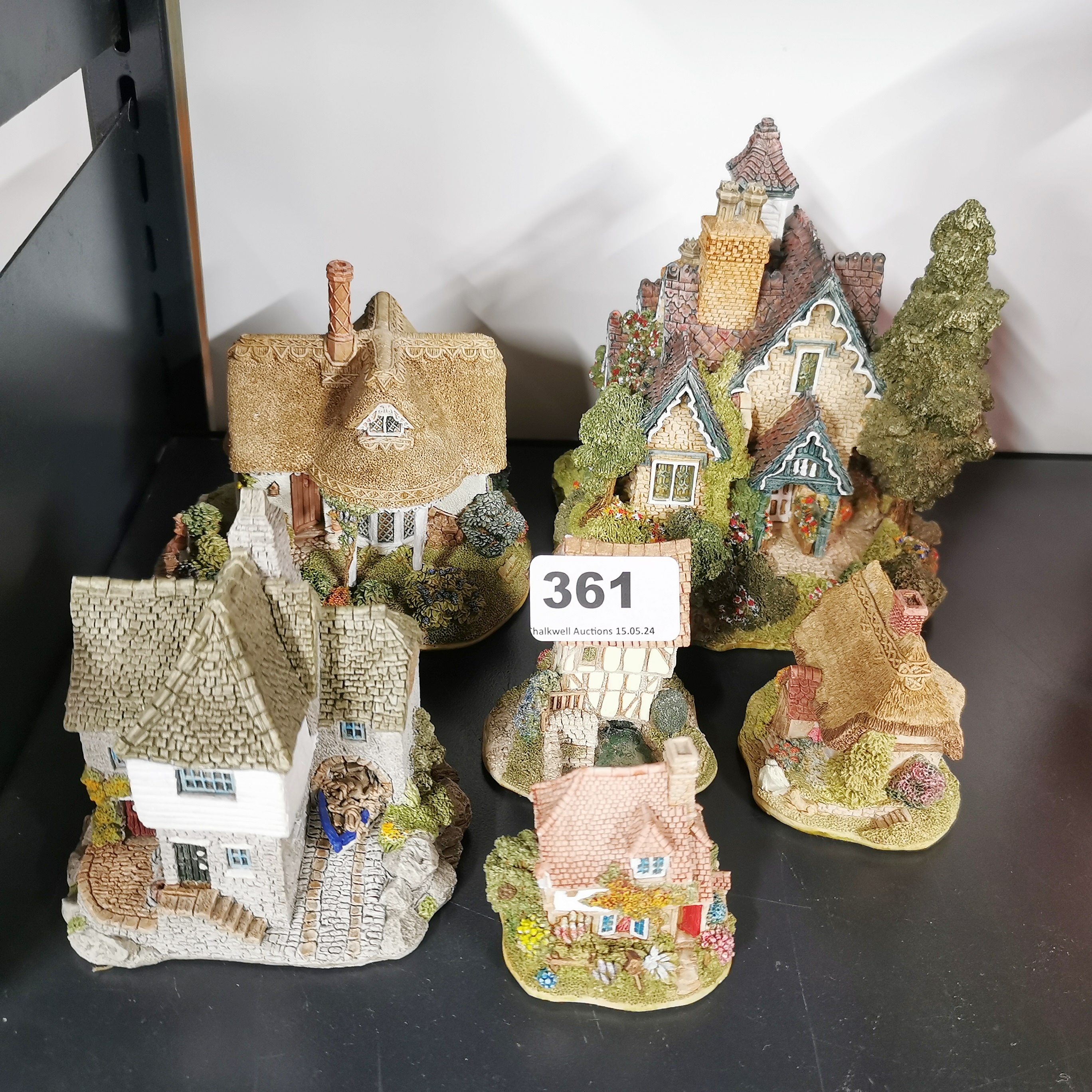 A group of six Lilliput Lane cottages with boxes, largest 15cm.