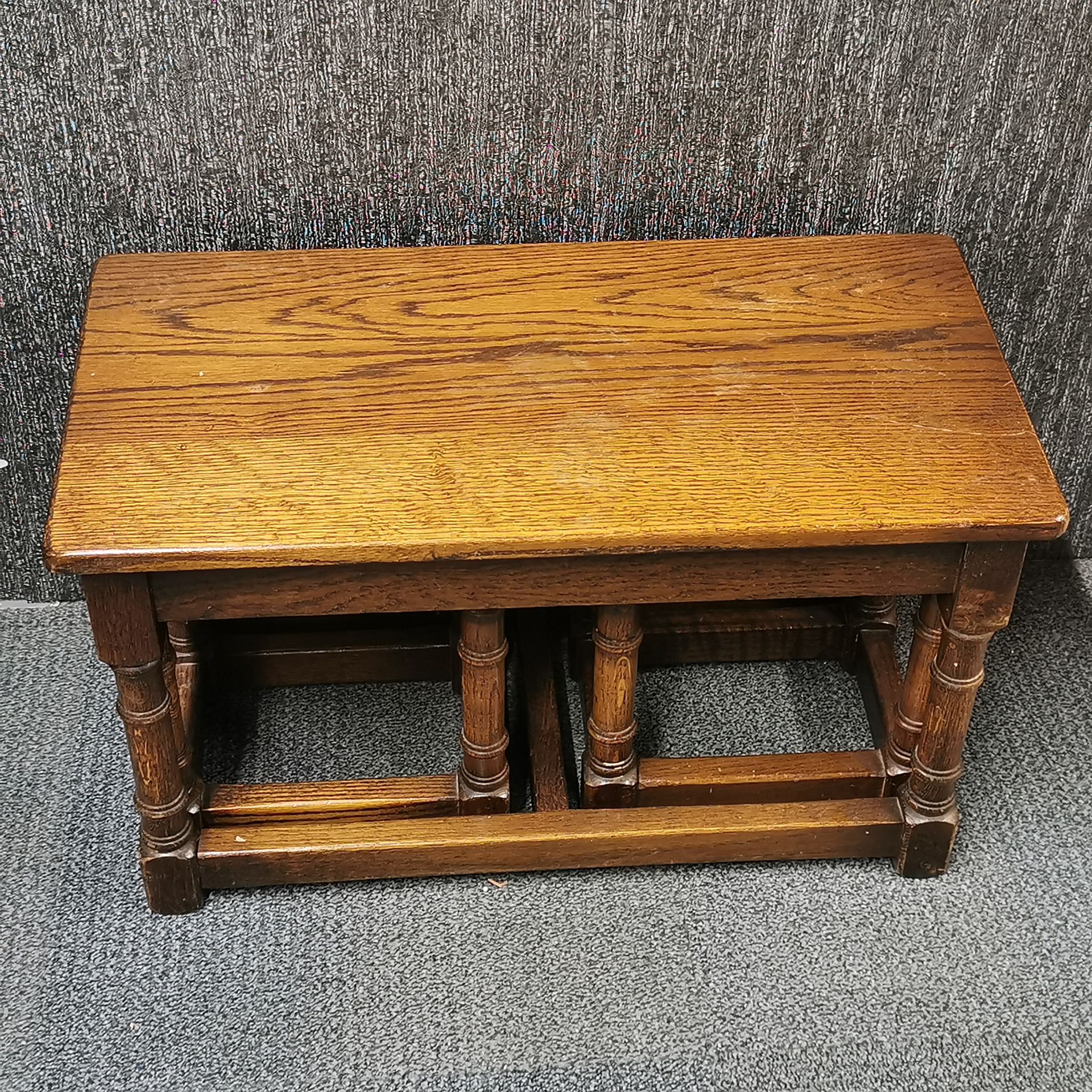 A nest of three heavy oak coffee tables, 68 x 35 x 41cm. - Image 2 of 2