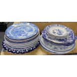 A quantity of blue and white china plates.