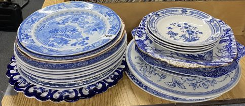 A quantity of blue and white china plates.