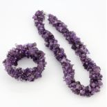 An amethyst bead with matching expandable bracelet.