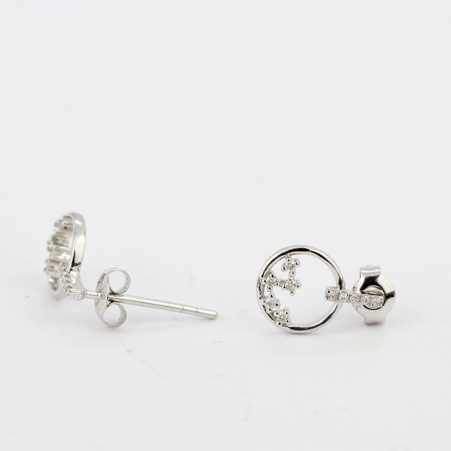 A pair of 9ct white gold diamond set earrings, L. 1.1cm. - Image 3 of 3