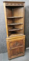 An oak corner cabinet, W. 67cm, H. 183cm.