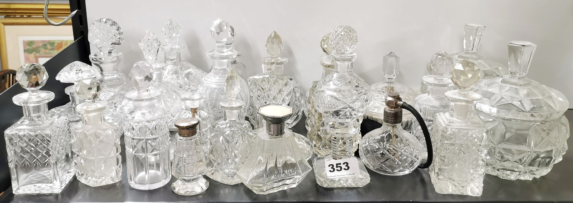 An extensive collection of cut glass perfume bottles and dressing table items, tallest 18cm.