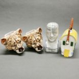 A pair of china lion head wall pockets, H. 18cm. Together with a phrenology head and a gypsy caravan