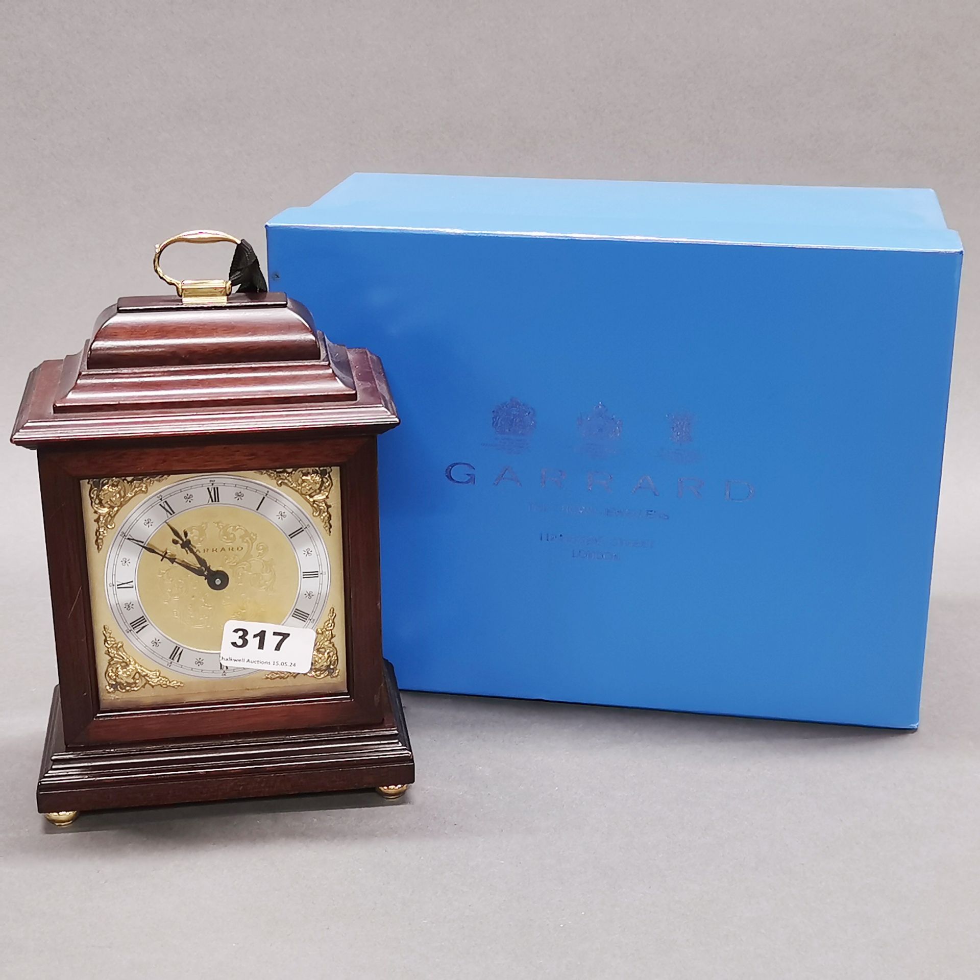 A Garrard mahogany mantel clock with box, H. 24cm. Together with a battery operated wall clock. - Image 2 of 3