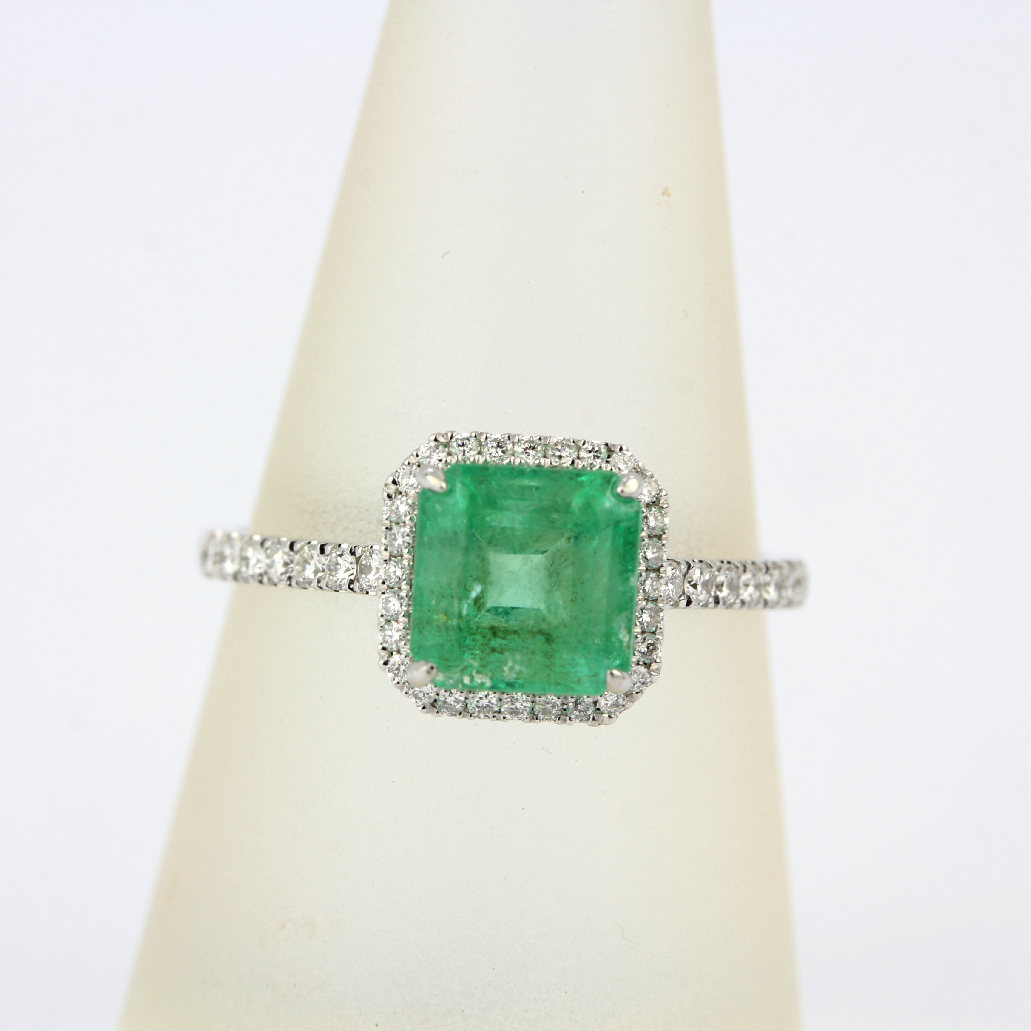 An 18ct white gold ring set with an emerald cut emerald and diamonds, ring size P. - Image 3 of 3