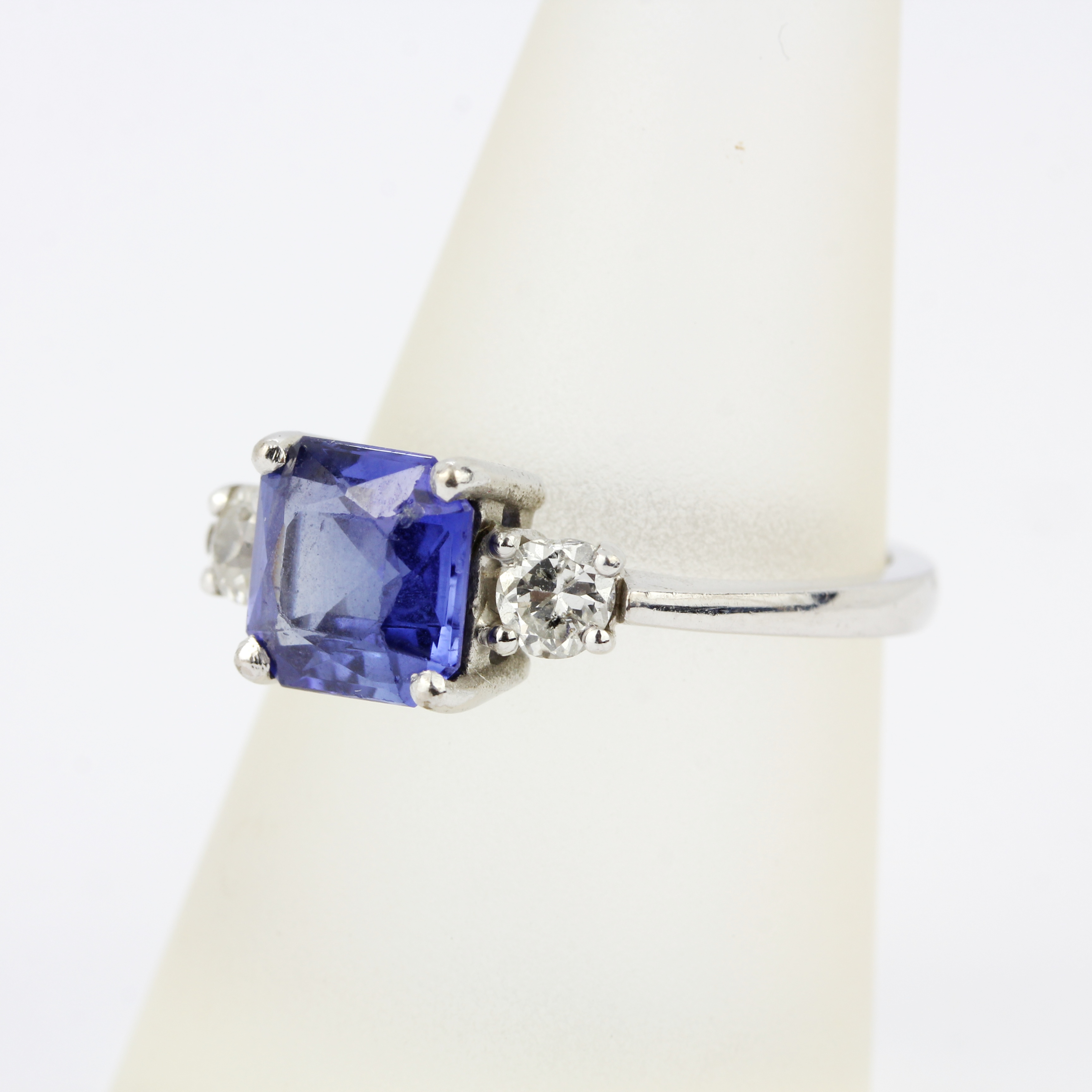 An 18ct white gold ring set with a fancy cut sapphire flanked by brilliant cut diamonds, diamonds - Image 2 of 4