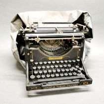 An antique Underwood desk typewriter.