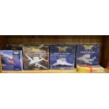 A group of Corgi diecast model aircraft.