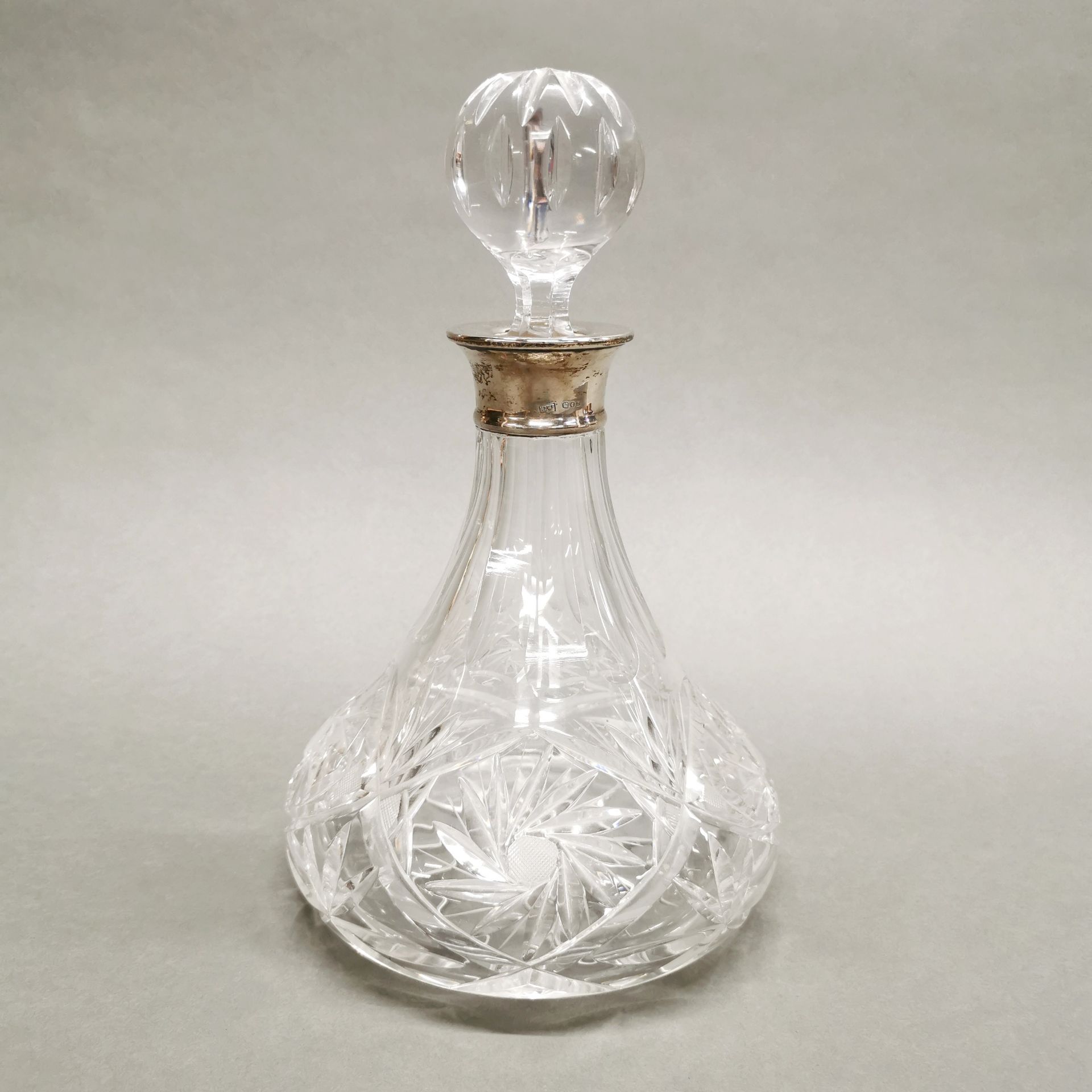 A silver collared cut crystal decanter, H. 27cm.