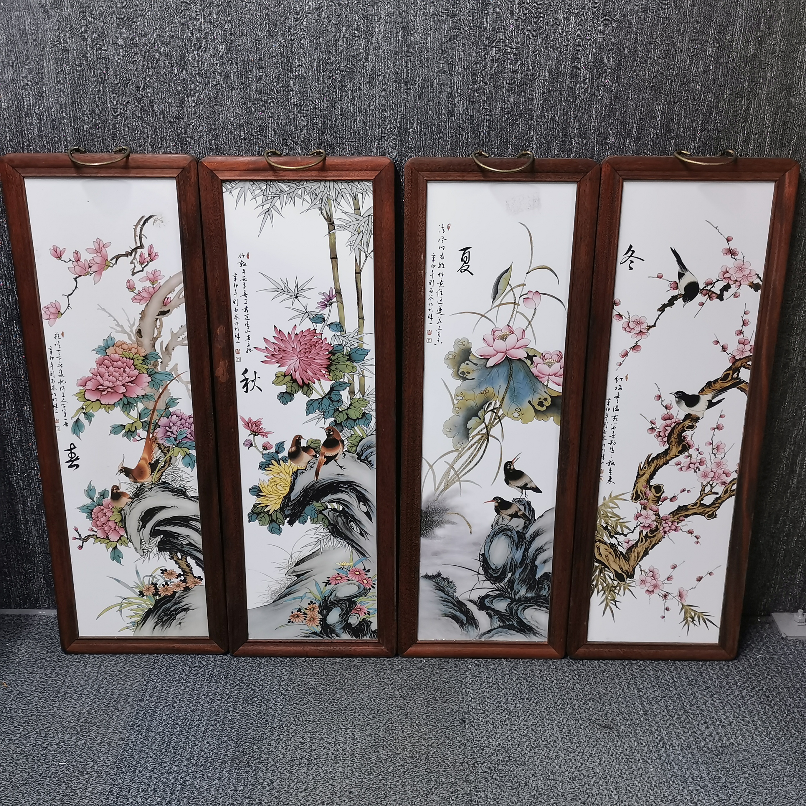 A hardwood framed set of four Chinese porcelain wall panels, H. 80cm.