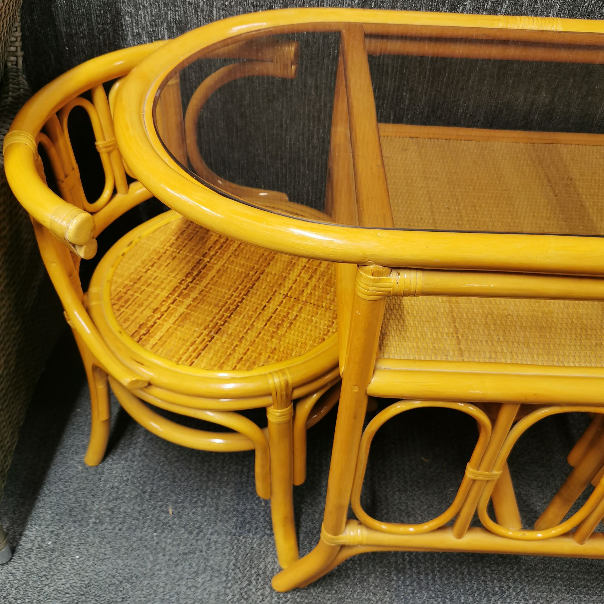 A vintage cane and glass conservatory/ kitchen set of table and two chairs, W. 110cm. - Image 3 of 3